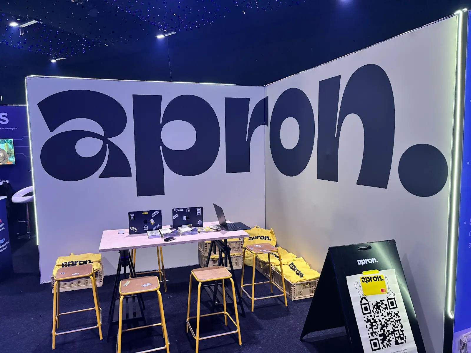 The Apron stand at an accounting conference, branded with nothing but its logo